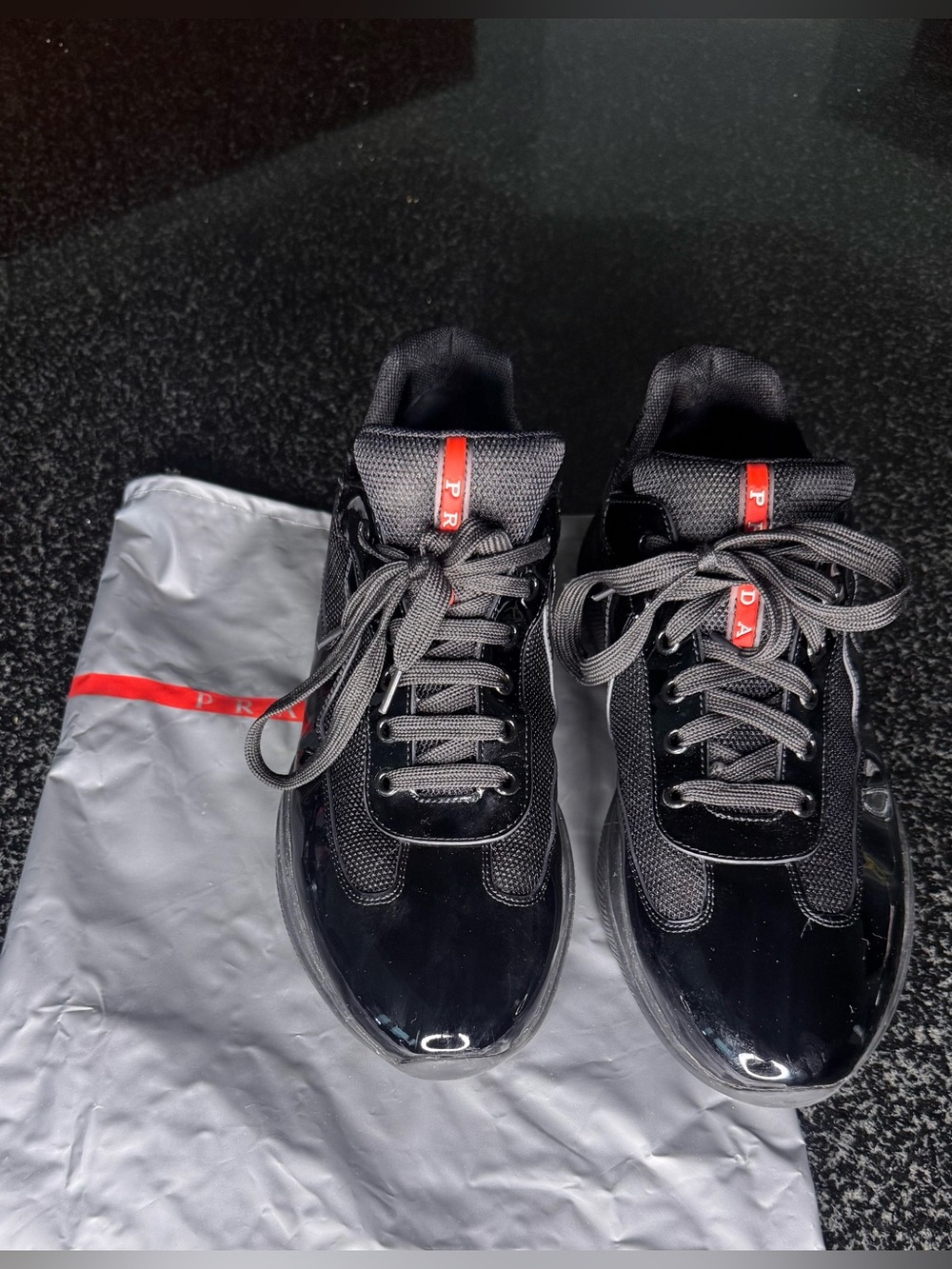 Prada Black Sneakers with Red Logo Tape